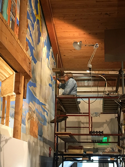 Tim Scheirer at work on a mural Tim Scheirer at work on a mural